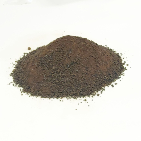 Pure grainy liquorice granulate in a jar for cooking and baking, iranian