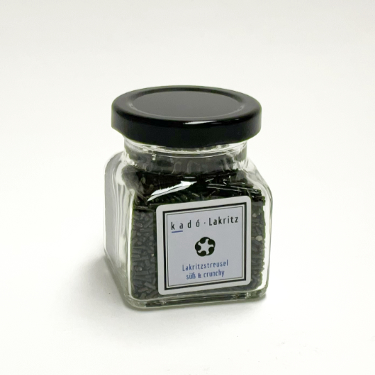 Jar of sweet liquorice sprinkles with anise flavour for ice cream and desserts