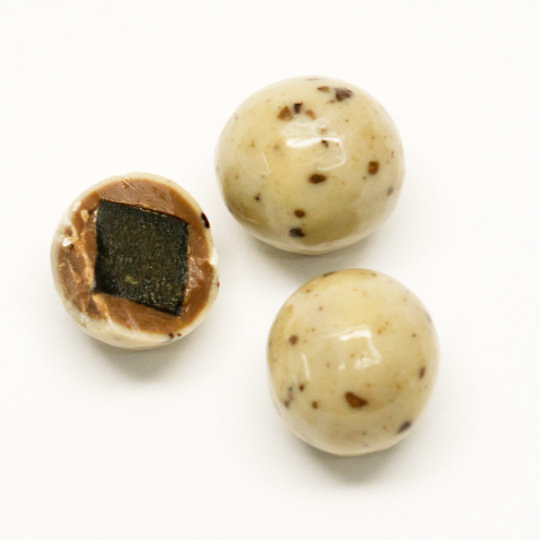 Box liquorice marbels in white chocolate with cappuchino, swedish