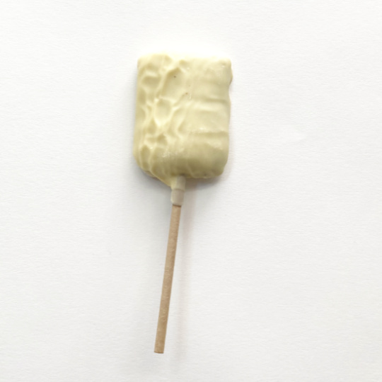 Salmiak lollypop covered in white chocolate, german