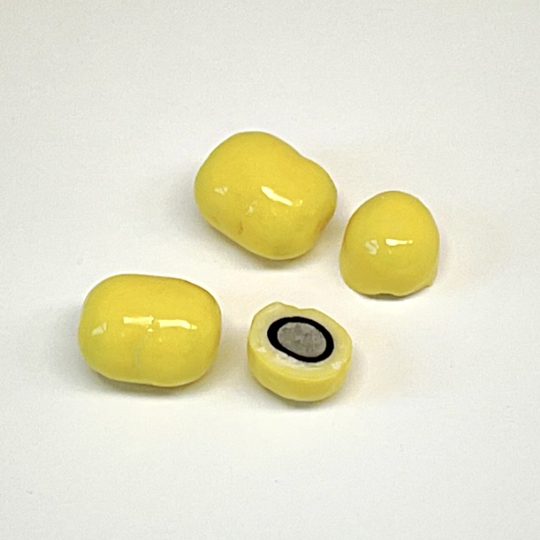 Liquorice coated with white choclate and citron, swedish