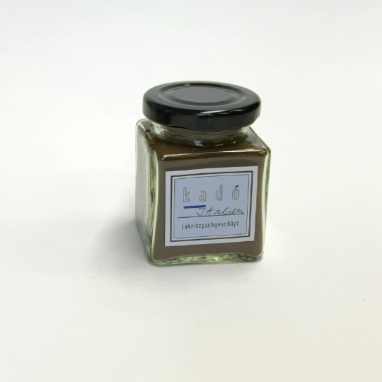 Pure liquorice powder in a jar, italian