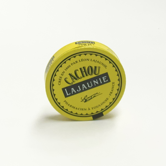 Tiny natural liquorice pastilles in the tin, french