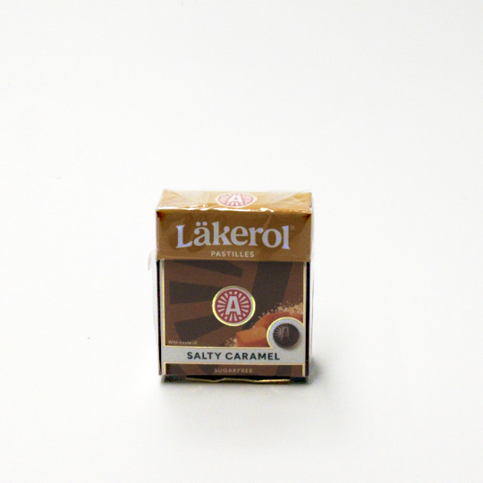 Firm liquorice pastilles with caramel and sweetener in a box, swedish