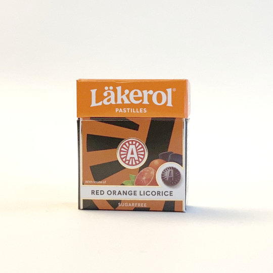 Firm liquorice pastilles with orange and sweetener in a box, swedish