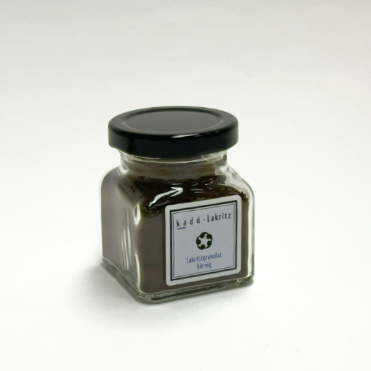 Pure grainy liquorice granulate in a jar for cooking and baking, iranian