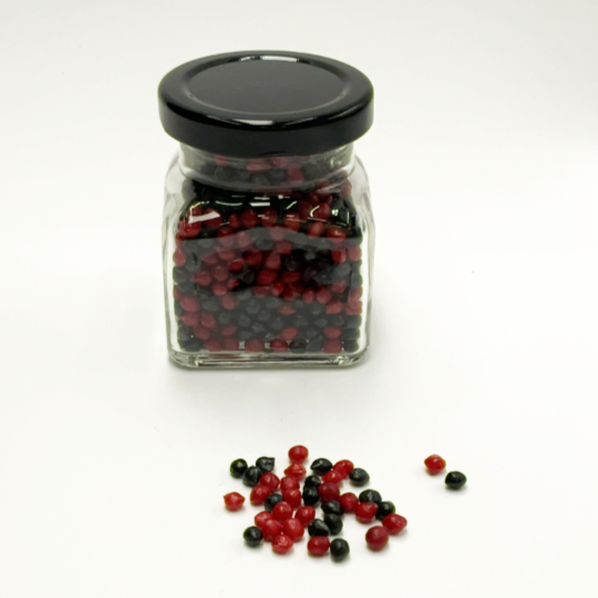 Raspberry liquorice pearls, ideal over ice cream, for decorating desserts, biscuits, chocolates.