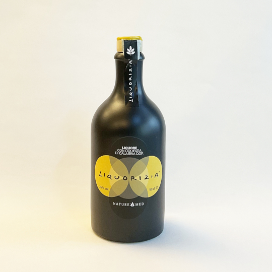 Creamy liquorice liquor from calabria in the stoneware bottle with 26% alcohol