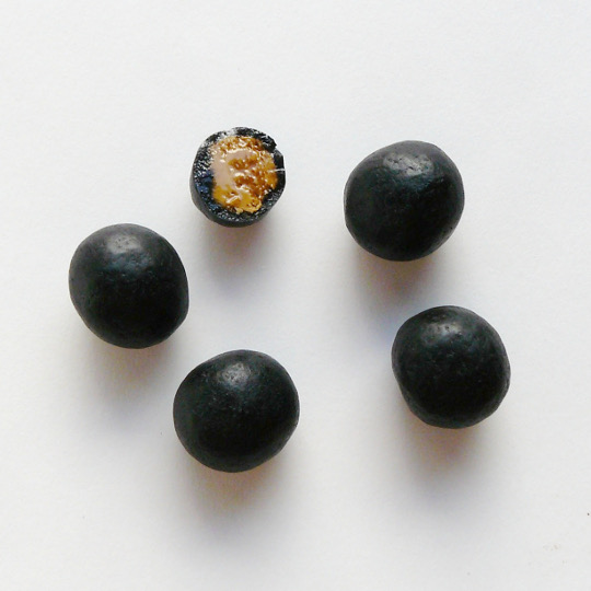 Tangy liquorice marbles filled with sweet-salty salmiac, dutch