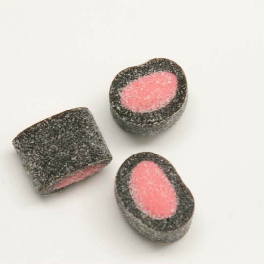 Sprinkled liquorice rolls filled with strawberry, finnish