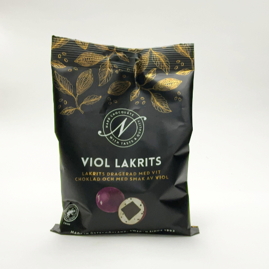 Bag with 120g liquorice covered with white chocolate and violet, swedish