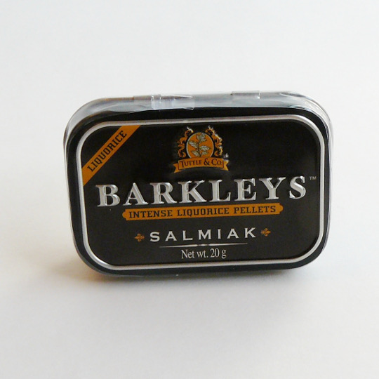 Tin of firm salmiac liquorice pastilles, english