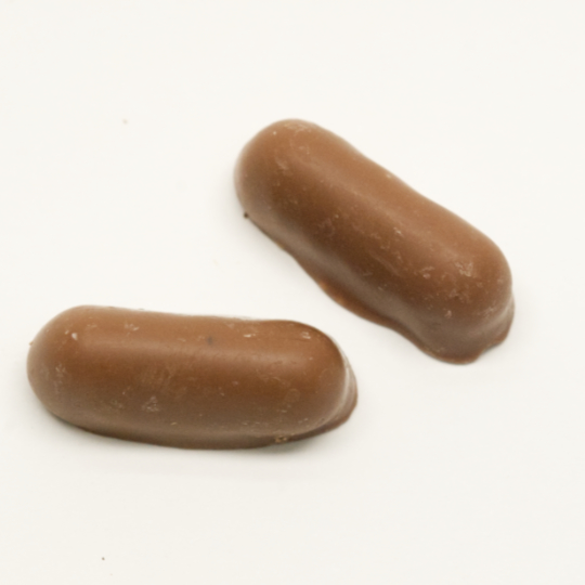 Soft strong salmiak with pepper covered in milk chocolate, german