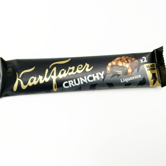 Bar sweet liquorice toffee with chocolate and puffed rice, finnish