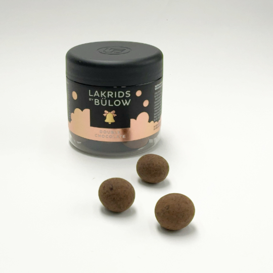 Dark chocolate marbles with liquorice kernel in a box , danish