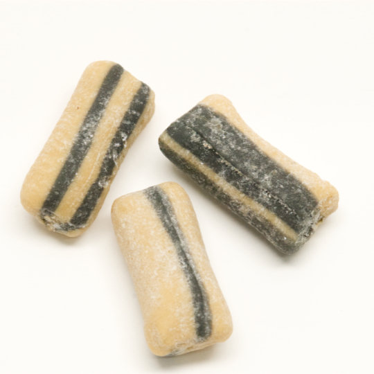 Liquorice bonbon filled with salmiac and caramel powder, swedish