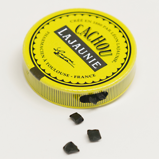 Tiny natural liquorice pastilles in the tin, french