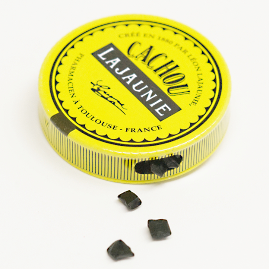 Tiny natural liquorice pastilles in the tin, french