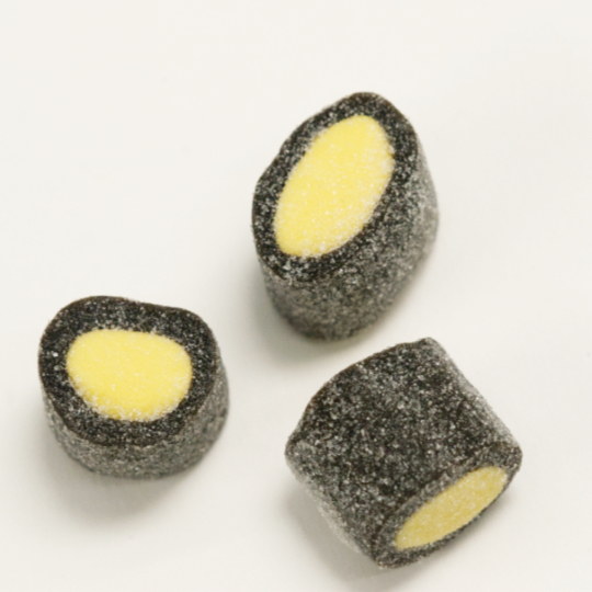 Sprinkled liquorice rolls filled with lemon, finnish