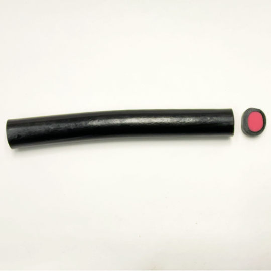 Mild liquorice cane filled with strawberry, finnish