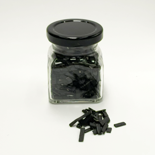 Salty liquorice flakes, ideal over ice cream, for decorating desserts, biscuits, chocolates and...