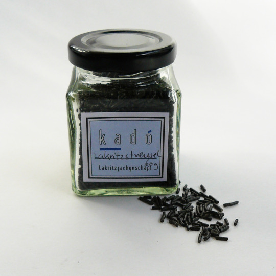 Jar of sweet liquorice sprinkles with anise flavour for ice cream and desserts