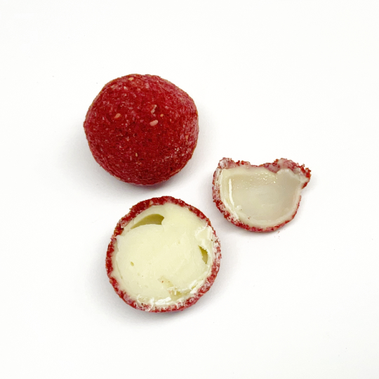 Raspberry-liquorice praline in white chocolate, german